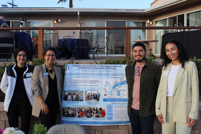 Ji staff and students posing at an event event
